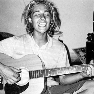 Young Daniel Johns playing guitar